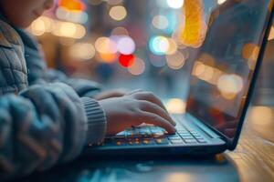 AI generated Close-up of a child typing on a laptop at a table, outdoors photo