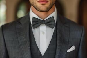 AI generated Close-up of a man dressed in a smart suit and classic bow tie, showing off his wedding attire. The groom looks stylish and sophisticated photo