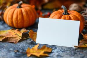 AI generated Blank greeting card mockup lies on a pile of autumn leaves and pumpkins, halloween photo