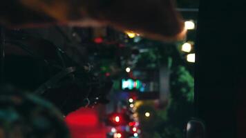 Bokeh lights from urban street at night with shallow depth of field. video