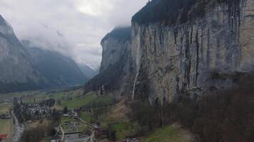 Beautiful aerial view of the Staubbach Falls in Switzerland. Magical panoramic aerial view of Switzerland during cloudy weather. video