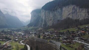 Beautiful aerial view of the Staubbach Falls in Switzerland. Magical panoramic aerial view of Switzerland during cloudy weather. video