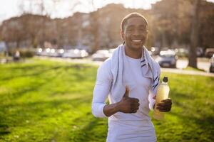 Portrait of young african-american man who is ready for jogging. photo