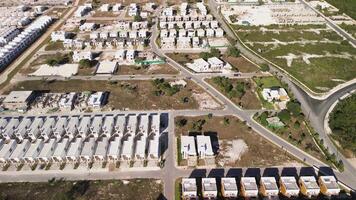 Designing new residential area named Vista Cana in Punta Cana, Dominican Republic, showcasing aerial views of ongoing construction of apartments and villas amidst tropical setting. Flying forward video