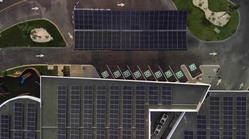 Aerial top view of innovative Electric Vehicle Charging Station. Zoom in video