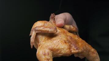 the chef prepares to cut a whole grilled chicken video