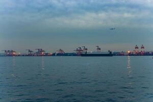 A dusk cityscape near the container port in Tokyo photo