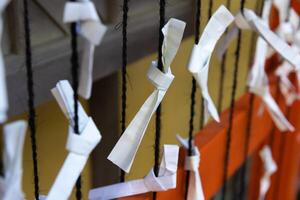 A fortune paper OMIKUJI at Japanese Shrine photo