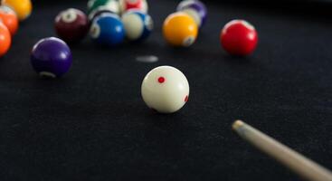 Close up View of Man Playing Pool Table photo