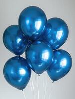 blue color balloons for celebration or party against a clean white background photo