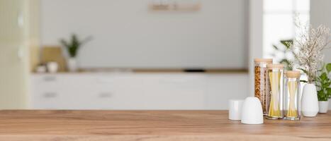 A space for display products on a wooden kitchen tabletop in a modern white kitchen. photo