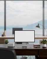 A white-screen computer mockup on a desk in a modern spacious office with a beautiful nature view. photo