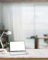 A modern home office with a laptop computer mockup and accessories on a white marble table. photo