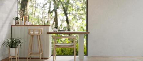 The interior design of a contemporary neutral lounge features a mini counter bar near by the window. photo