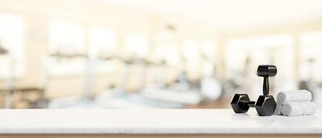 A presentation space on a white table features dumbbells and towels in a modern fitness. photo