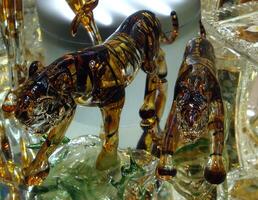 Pictures of glass figurines depicting animals photo