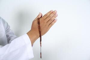 muslim hands in greeting gesture with holding prayer beads isolated photo