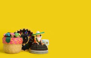 Cinco de Mayo festive background. Mexican handicrafts on yellow background. photo