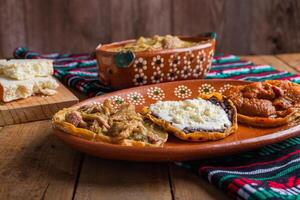 Sopes of chicharron in green sauce and red sauce. Mexican food. photo