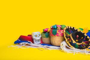 Cinco de Mayo festive background. Mexican handicrafts on yellow background. photo