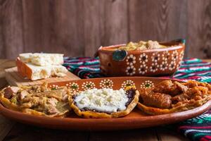 Sopes of chicharron in green sauce and red sauce. Mexican food. photo