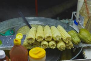 Boiled corn stand, typical Mexican street food. Food stall. photo