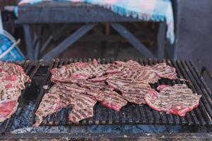 Grilled meat on a rustic grill in Mexico. Street stall of grilled meat. photo