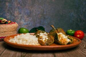 Stuffed peppers, typical mexican food. Food to celebrate Cinco de Mayo. photo