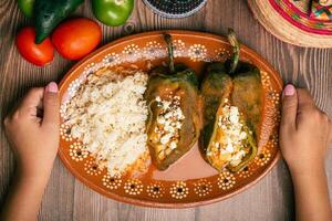 Stuffed peppers, typical mexican food. Food to celebrate Cinco de Mayo. photo