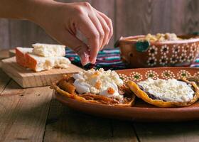 Sopes of chicharron in green sauce and red sauce. Mexican food. photo