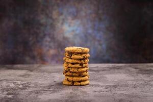 Pile of vanilla chocolate chip cookies. A delicious dessert. photo