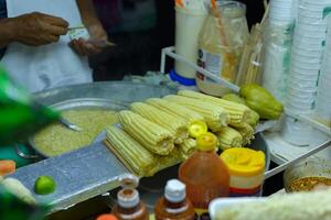 Boiled corn stand, typical Mexican street food. Food stall. photo