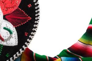 Mariachi hat and colorful serape with copy space. Cinco de mayo background. photo
