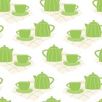 Seamless pattern with a green teapot and cup set vector