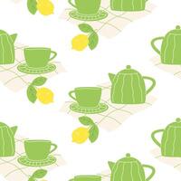 Seamless pattern with teapot, cup, hot tea and lemon vector