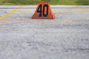 an orange forty yard line marker ready for a marching band rehearsal photo