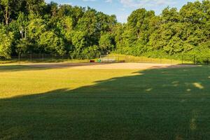 looking in towards Homeplate of this baseball field from centerfield viewpoint photo