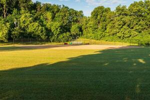 looking in towards Homeplate of this baseball field from centerfield viewpoint photo