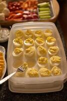 a serving tray of deviled eggs that used to be full photo
