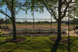 early sunrise at a baseball field in a municipal park photo