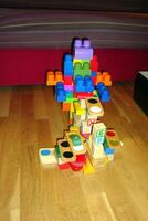 an abstract structure made with plastic and wooden toys photo