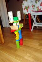 an abstract structure made with plastic and wooden toys photo