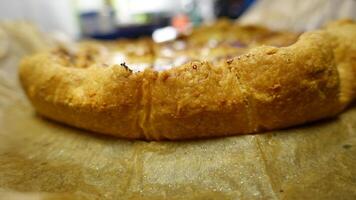 The cornice of a flan filled with pears, walnuts and gorgonzola cheese photo