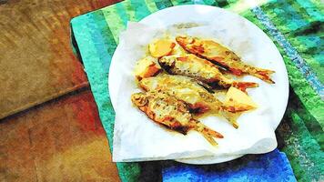 watercolorstyle representing a plate of small fried fish with lemon ready to serve photo