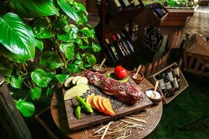 Wooden Cutting Board With Freshly Prepared Meat and Vegetables photo