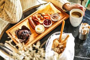 Tray of Food on Table With Cup of Coffee photo