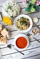 Table With Assorted Plated Food and Drinks photo