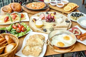 Variety of Food Displayed on Table photo