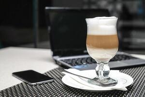 Glass of Liquid on White Plate photo