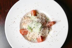 White Plate With Food on Wooden Table photo